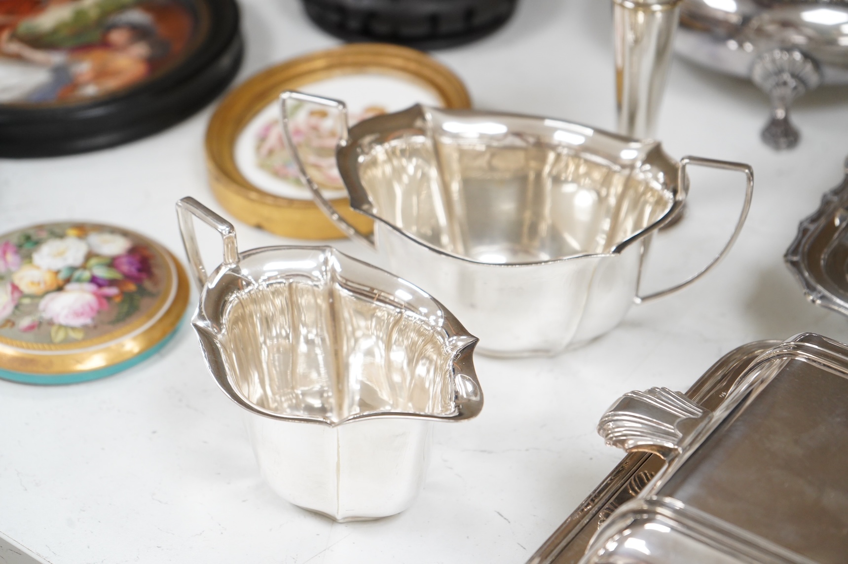 A collection of plated wares to include a vintage cocktail shaker with recipes, wine cooler and two plated entrée dishes including Art deco, largest 29cm wide